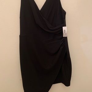Black mini dress , with split on the side.